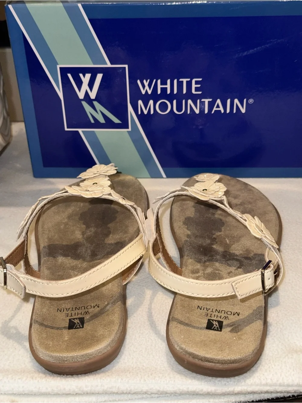 White Mountain Liftoff Flat Sandals feature delicate floral applique on T-strap